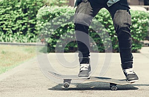 Boy skater is doing stunt at the street