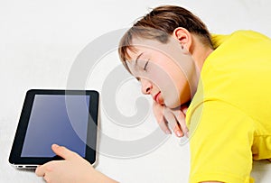 Boy sleep with a Tablet