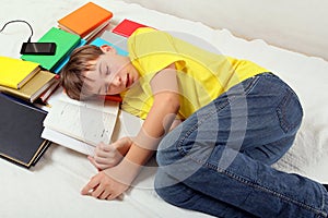 Boy sleeping on the Books