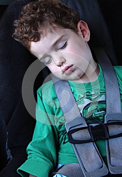 Boy sleeping in the car