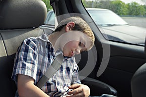 Boy Sleeping in Car