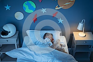 Boy sleeping and dreaming a future in the space