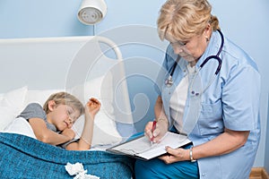 Boy sleeping in hospital bed