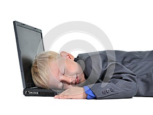 Boy sleeping on laptop tired of work