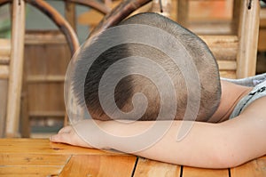 Boy sleeping on table