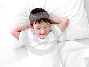 Boy sleeping tight on the side, copy space