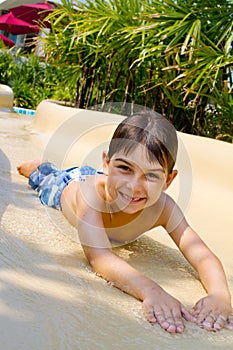 Boy Sliding Down Water Slide.