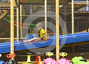 Boy sliding on playground