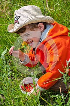 Boy smelling the flower with exhilaration