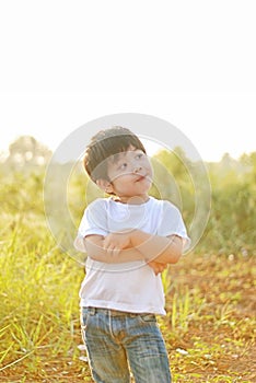 Boy smile happy in the morning, there is a backyard.