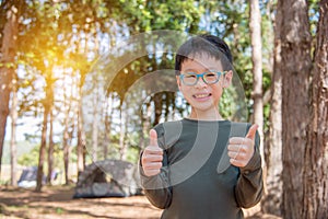 Boy smiling in camping site