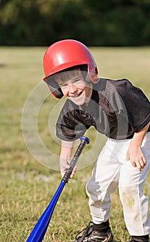 Boy Smiling Getting Ready to Hit
