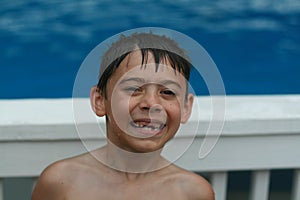 Boy smiling with missing teeth