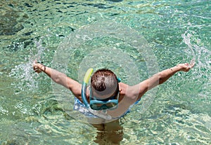 Boy with snorkel and mask explore underwater. Snorkeling swimming, summer activity on beach family vacation, water sport