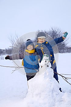 Boy with snow man