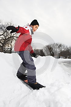 Boy snowboarding.