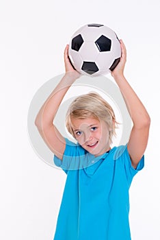 Boy with soccer ball in front of white background