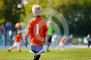 Boy Soccer Goalkeeper on the Field. Young Football Goalie on Kids Sports Competition