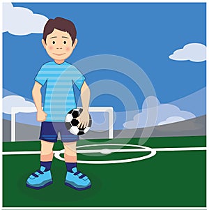 Boy soccer player with a ball in his hands on the football field