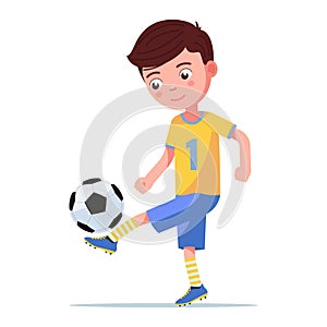 Boy soccer player kicking the ball on his leg