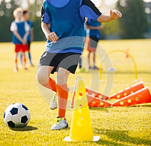 Boy Soccer Player In Training Drill. Young Soccer Players at Practice