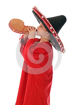 Boy in spanish red shirt and sombrero drinking from bota bag photo