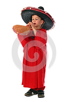 Boy in spanish red shirt and sombrero holding bota bag with wine photo