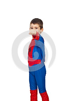 Boy in spider costume showing fist hand