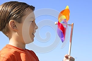 Boy with a spinning wheel pinwheel