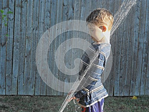 Boy in the Sprinkler