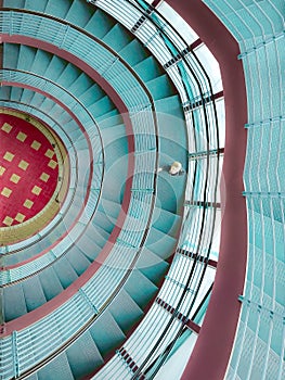 Boy in stairwell with colorful patterns