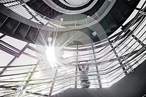 Boy in stairwell with sun beam