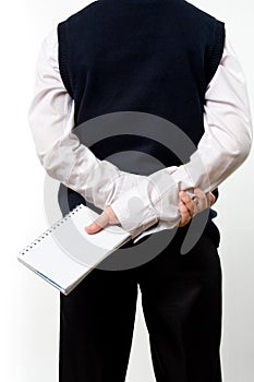 Boy standing backwards with the notepad in hand