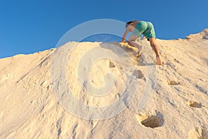 Boy standing on the beach