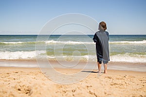 Boy standing on the beach