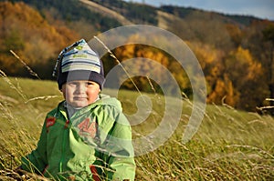 Boy standing in bent-grass