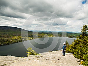 Boy standing on a cliff