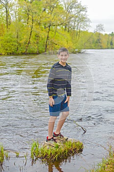 Boy Standing on Rock in the Wisconsin River - Merrill, WI photo
