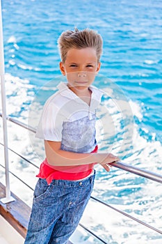 A boy standing on a ship