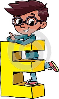 boy stands on the capital letter E