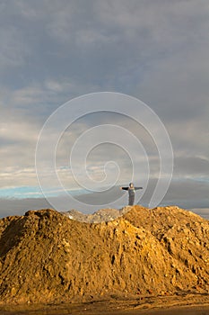 Boy stands on the hill in the early spring.