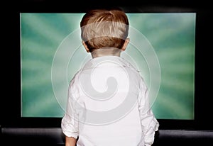 Boy staring at tv screen