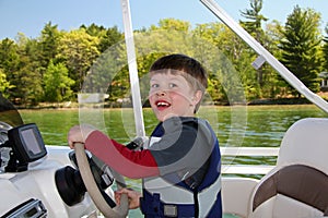 Boy Steering Boat