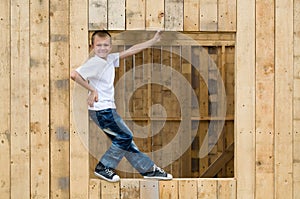 Boy stood in the window opening