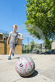 Boy at a Street soccer pitch