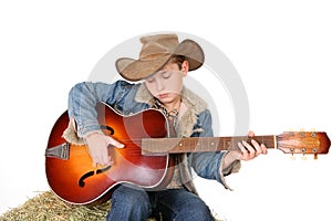 Boy strumming guitar