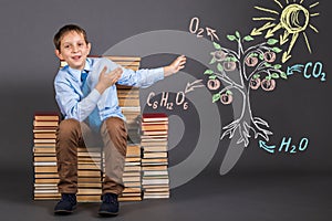 Boy student demonstrates the principle of photosynthesis