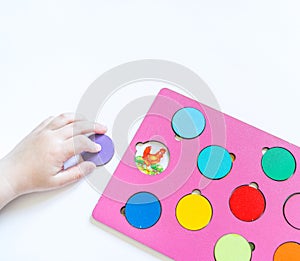 Boy students Child`s hands learning biology with montessori material
