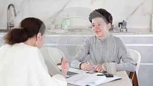 Boy studying and learning with tutor using laptop. Boy studying with tutor