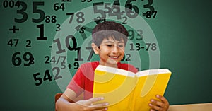 Boy studying while numbers flying in background
